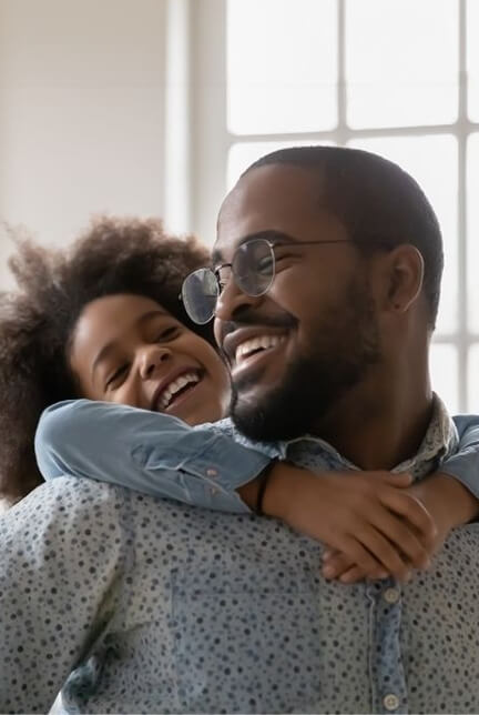 Father and daughter laughing together.